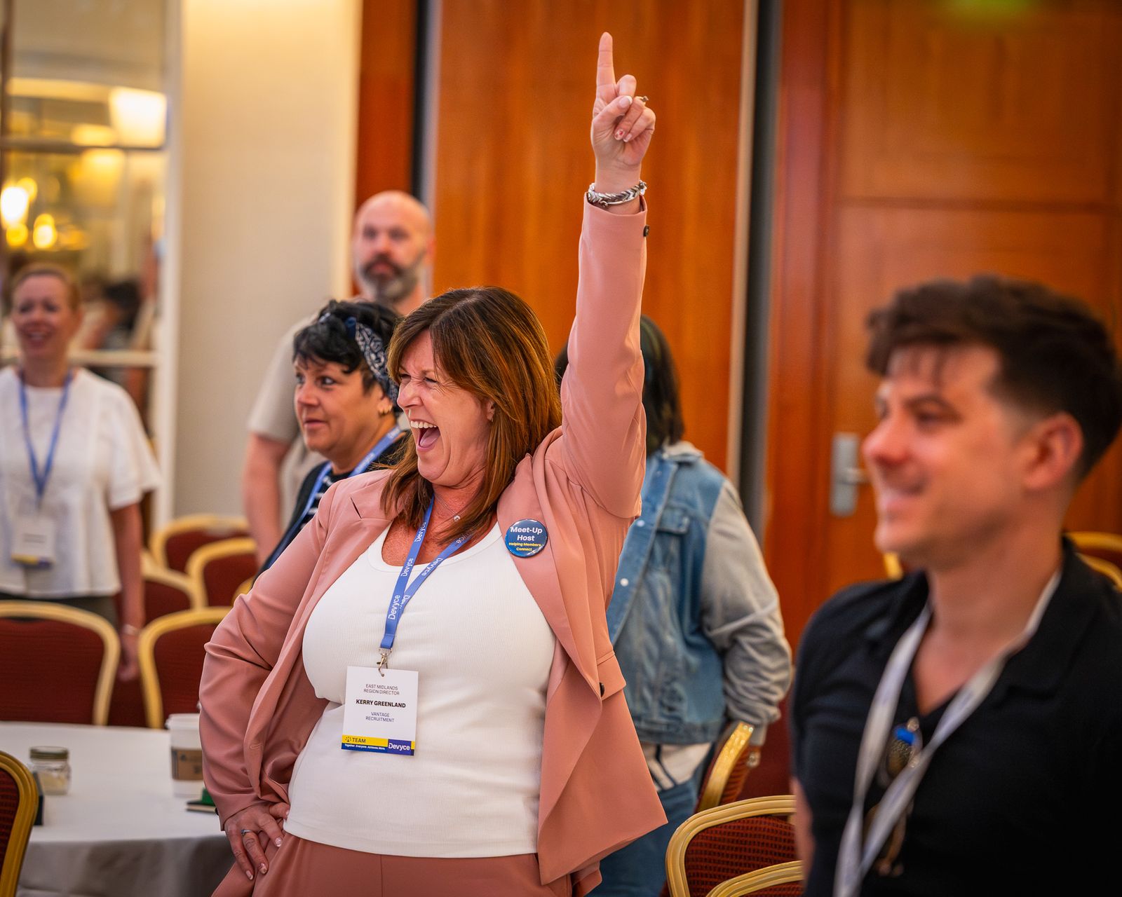 Audience member cheering during a conference session