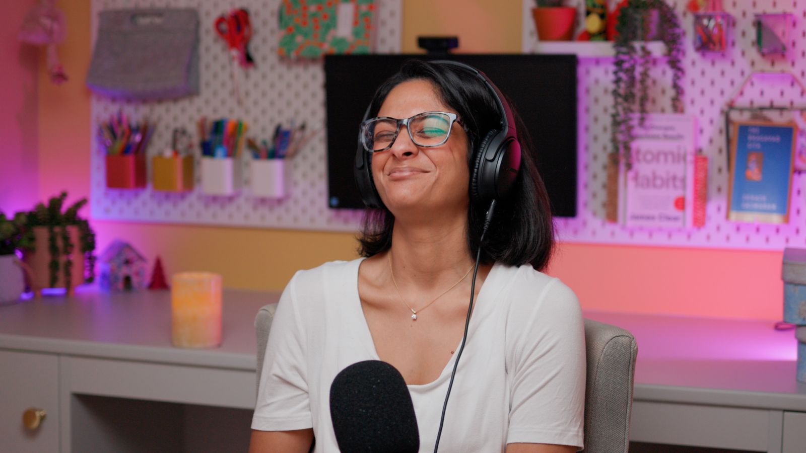 Podcast host in a colourful home studio