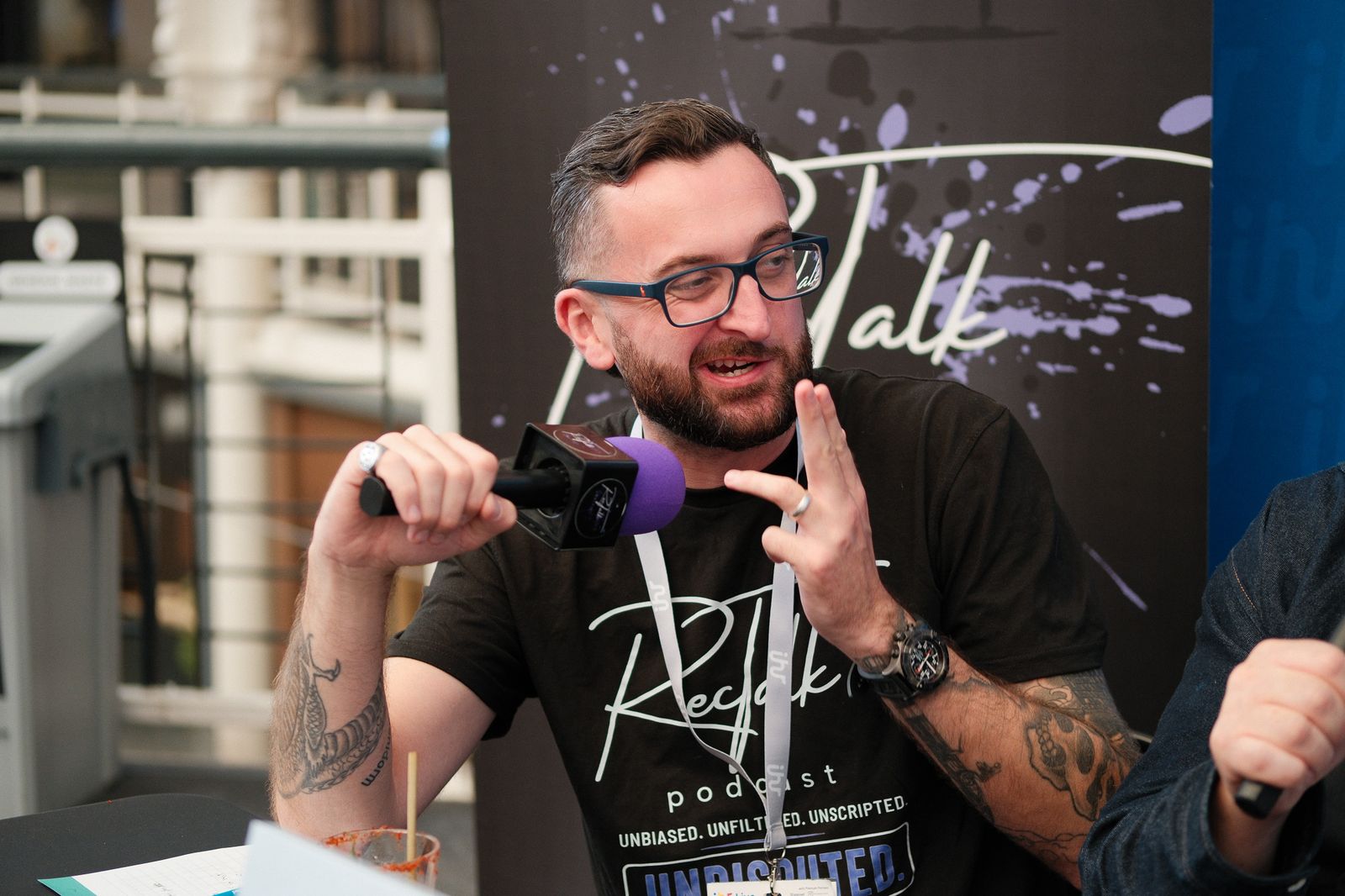 Podcast guest mid-conversation at a live recording